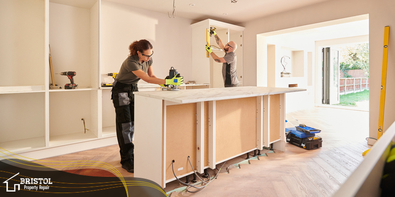 Experts installing cabinets